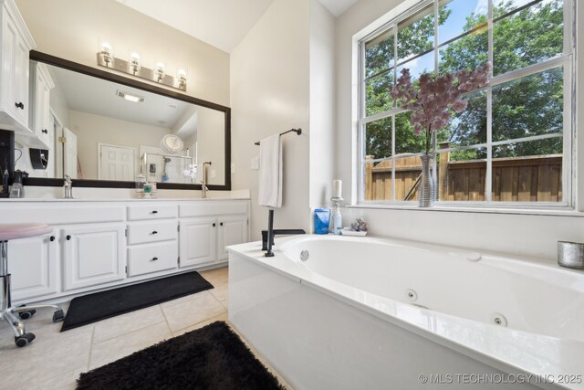 4602 S Linwood Dr, Sand Springs, OK 74063 - bathroom with double vanity, tile patterned flooring, and a tub with jets