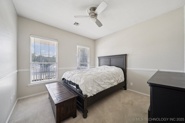 4602 S Linwood Dr, Sand Springs, OK 74063 - bedroom featuring multiple windows, light carpet, and a ceiling fan