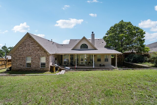 4602 S Linwood Dr, Sand Springs, OK 74063 - rear view of house with a chimney, a shingled roof, brick siding, and french doors