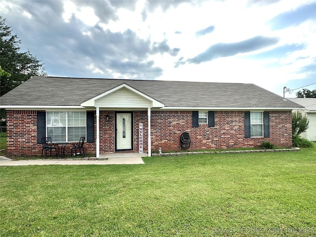 2101 N 11th, Mcalester, OK 74501 - single story home with a front yard, brick siding, and roof with shingles