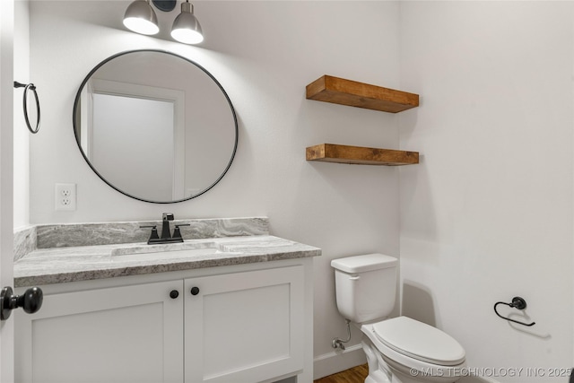 2978 E 146th St S, Bixby, OK 74008 - half bathroom with toilet, vanity, wood finished floors, and baseboards