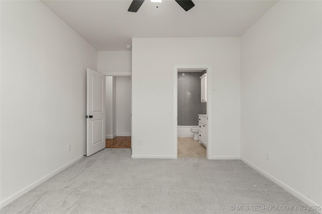 2978 E 146th St S, Bixby, OK 74008 - unfurnished bedroom with light colored carpet, baseboards, connected bathroom, and a ceiling fan