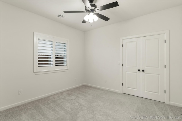 2978 E 146th St S, Bixby, OK 74008 - unfurnished bedroom featuring light colored carpet, baseboards, a closet, and ceiling fan