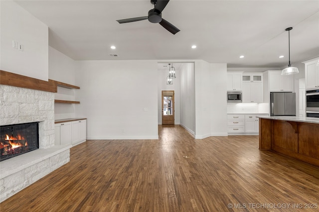 2978 E 146th St S, Bixby, OK 74008 - unfurnished living room featuring a fireplace, a ceiling fan, dark wood-style floors, baseboards, and recessed lighting