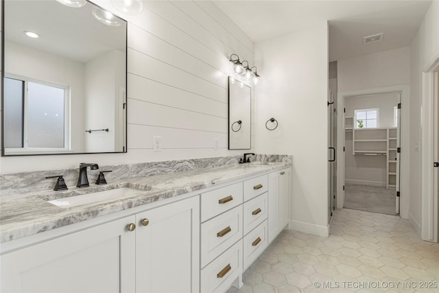 2978 E 146th St S, Bixby, OK 74008 - full bath featuring double vanity, a spacious closet, tile patterned floors, baseboards, and recessed lighting