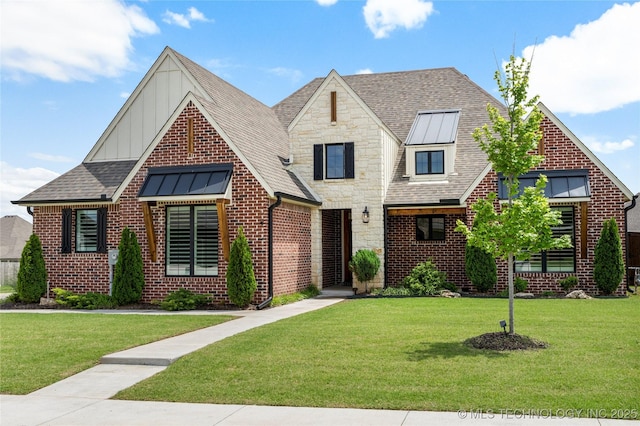 2978 E 146th St S, Bixby, OK 74008 - view of front facade featuring a front yard, board and batten siding, and brick siding