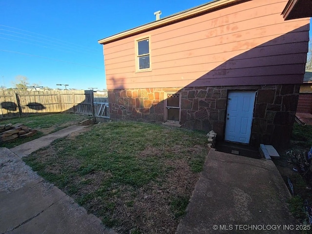 1324 N 3rd, Durant, OK 74701 - view of side of property featuring stone siding