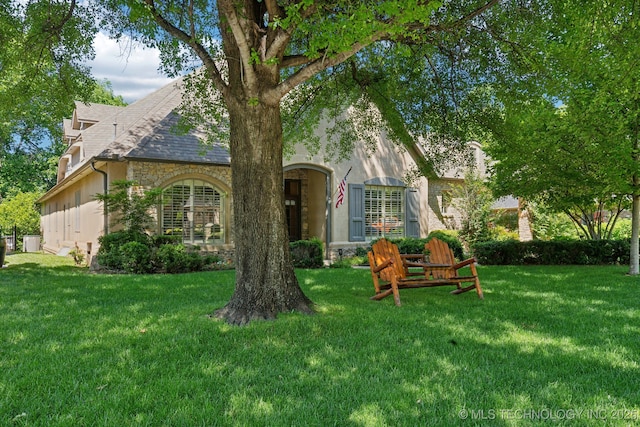 3335 E 93rd St, Tulsa, OK 74137 - view of front of property with a front yard and stone siding