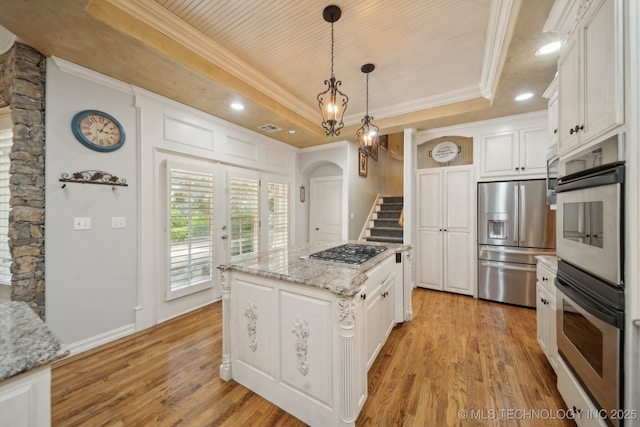 3335 E 93rd St, Tulsa, OK 74137 - kitchen featuring stainless steel appliances, a raised ceiling, crown molding, white cabinets, and light wood-style floors