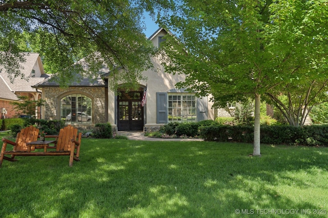 3335 E 93rd St, Tulsa, OK 74137 - view of front of house featuring french doors, a front yard, and stone siding