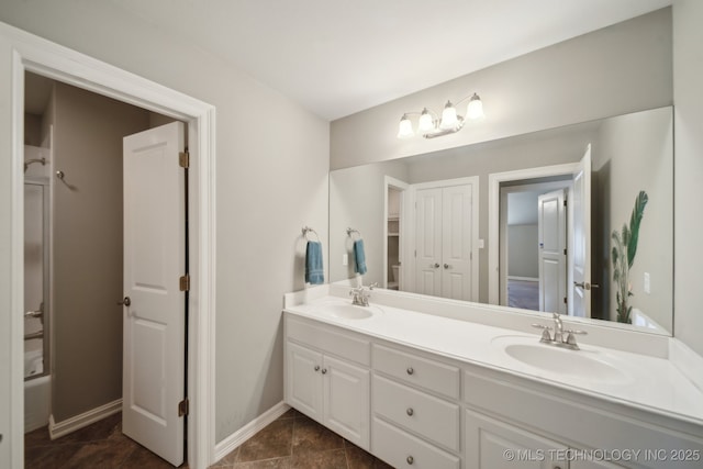 3335 E 93rd St, Tulsa, OK 74137 - full bath featuring double vanity, baseboards, and tub / shower combination