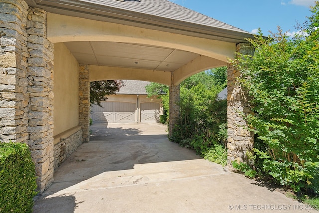 3335 E 93rd St, Tulsa, OK 74137 - view of patio / terrace with driveway and a garage