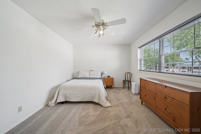 5538 E 46th St Unit 9, Tulsa, OK 74135 - bedroom featuring light colored carpet, baseboards, and ceiling fan