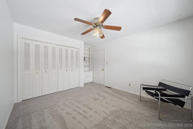 5538 E 46th St Unit 9, Tulsa, OK 74135 - carpeted bedroom with baseboards, a ceiling fan, and a closet