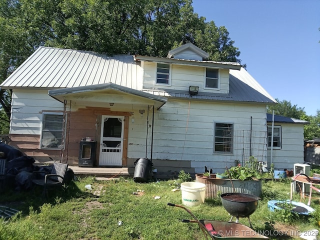 212 N Houglan St, Nowata, OK 74048 - view of front of home with metal roof