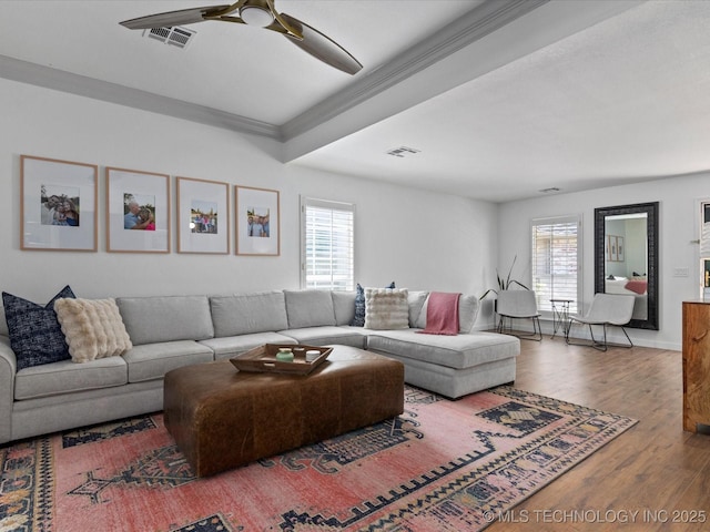 5553 S Delaware Ct, Tulsa, OK 74105 - living room featuring plenty of natural light, ceiling fan, wood finished floors, and crown molding