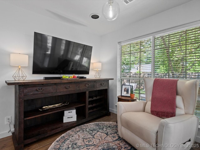 5553 S Delaware Ct, Tulsa, OK 74105 - sitting room featuring wood finished floors and baseboards