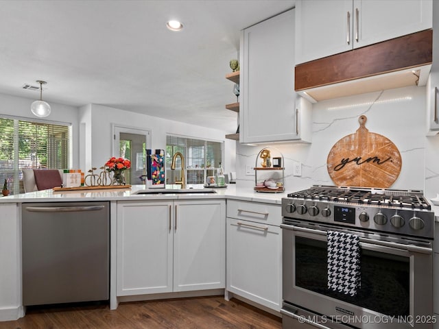 5553 S Delaware Ct, Tulsa, OK 74105 - kitchen with appliances with stainless steel finishes, a sink, white cabinets, light countertops, and dark wood finished floors