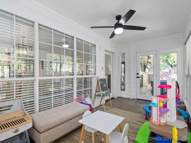 5553 S Delaware Ct, Tulsa, OK 74105 - sunroom with wood finished floors, ornamental molding, and a deck