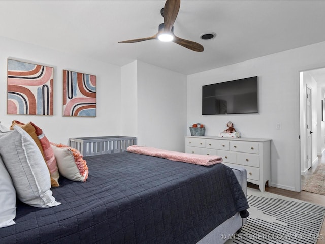 5553 S Delaware Ct, Tulsa, OK 74105 - bedroom featuring light wood-type flooring, ceiling fan, and baseboards