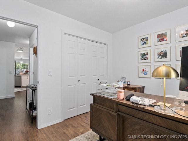 5553 S Delaware Ct, Tulsa, OK 74105 - home office featuring dark wood-style floors and baseboards