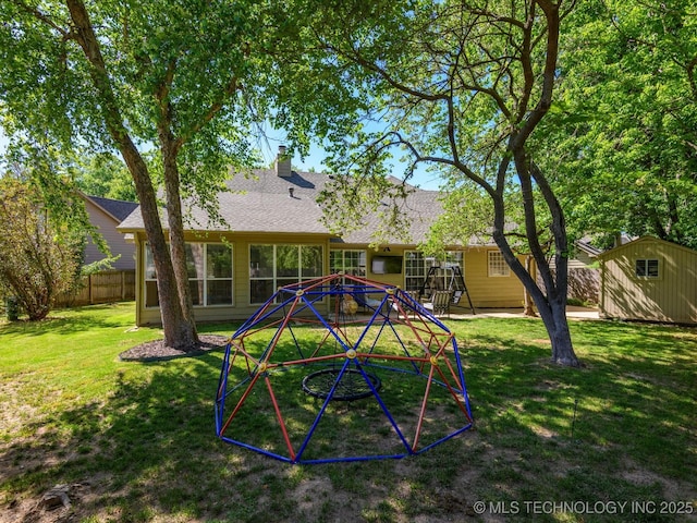 5553 S Delaware Ct, Tulsa, OK 74105 - back of property featuring a chimney and roof with shingles