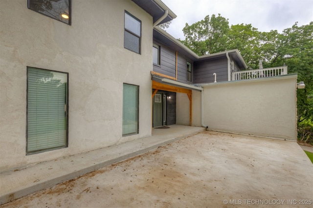 7423 S Urbana Ave, Tulsa, OK 74136 - rear view of house featuring a patio and stucco siding