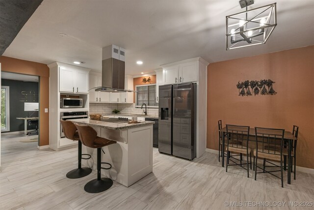 7423 S Urbana Ave, Tulsa, OK 74136 - kitchen featuring black appliances, island range hood, tasteful backsplash, white cabinets, and recessed lighting