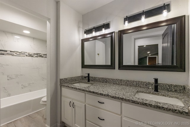 7423 S Urbana Ave, Tulsa, OK 74136 - bathroom with double vanity, wood finished floors, bathing tub / shower combination, and toilet