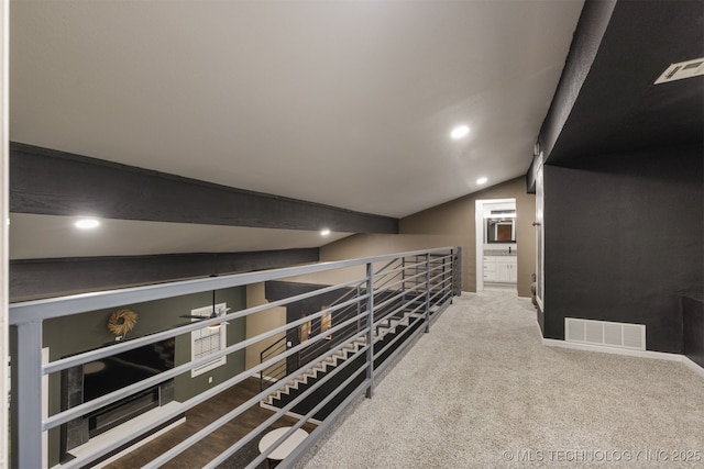 7423 S Urbana Ave, Tulsa, OK 74136 - hall featuring recessed lighting, vaulted ceiling, an upstairs landing, baseboards, and carpet flooring
