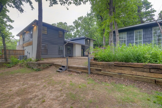 7423 S Urbana Ave, Tulsa, OK 74136 - rear view of property with central AC