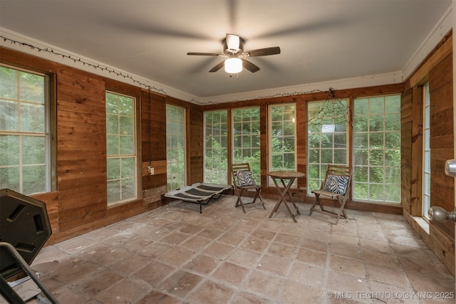 7423 S Urbana Ave, Tulsa, OK 74136 - sunroom / solarium featuring wooden walls and stone finish floors