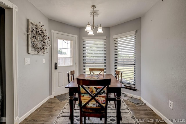 505 Teriwine, Perkins, OK 74059 - dining room with dark wood-style flooring, plenty of natural light, and a textured wall