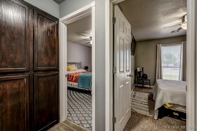 505 Teriwine, Perkins, OK 74059 - hall with carpet flooring and a textured ceiling