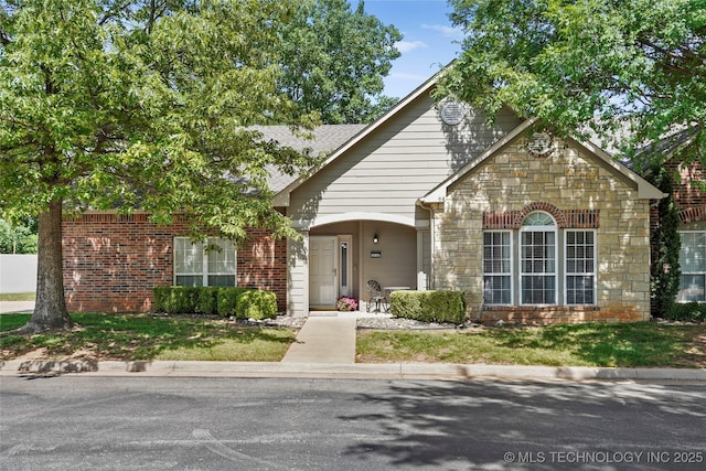 10107 S 94th E Pl, Tulsa, OK 74133 - view of front facade with stone siding