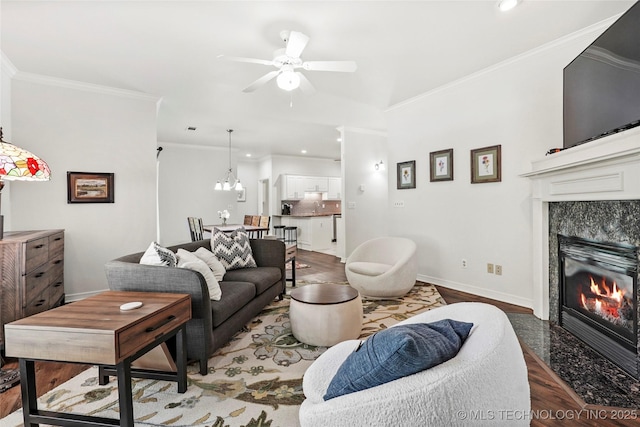 10107 S 94th E Pl, Tulsa, OK 74133 - living room featuring a ceiling fan, a fireplace, baseboards, ornamental molding, and recessed lighting