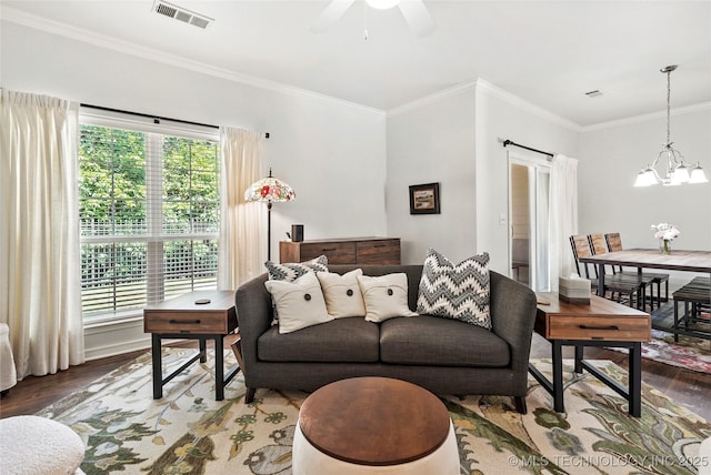 10107 S 94th E Pl, Tulsa, OK 74133 - living area featuring wood finished floors, a chandelier, ornamental molding, and ceiling fan