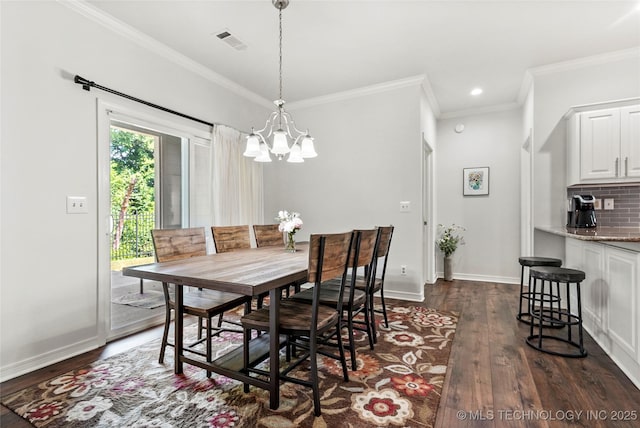 10107 S 94th E Pl, Tulsa, OK 74133 - dining area with a chandelier, dark wood finished floors, crown molding, baseboards, and recessed lighting
