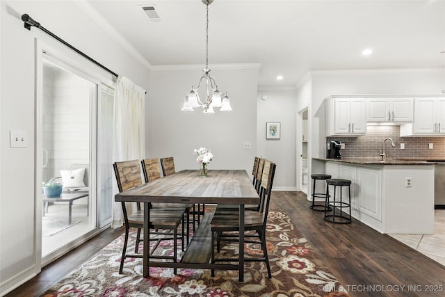10107 S 94th E Pl, Tulsa, OK 74133 - dining area featuring a chandelier, ornamental molding, dark wood-style flooring, and recessed lighting