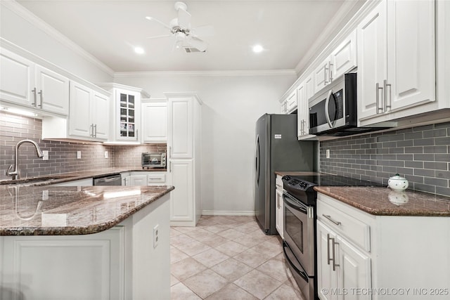 10107 S 94th E Pl, Tulsa, OK 74133 - kitchen featuring appliances with stainless steel finishes, a sink, white cabinetry, dark stone countertops, and ornamental molding