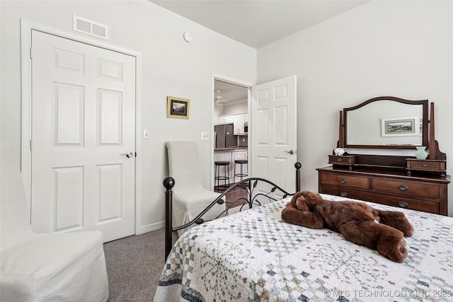 10107 S 94th E Pl, Tulsa, OK 74133 - carpeted bedroom with refrigerator and baseboards