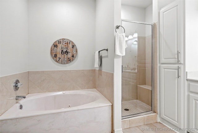 10107 S 94th E Pl, Tulsa, OK 74133 - full bathroom featuring a shower stall, a garden tub, and tile patterned floors