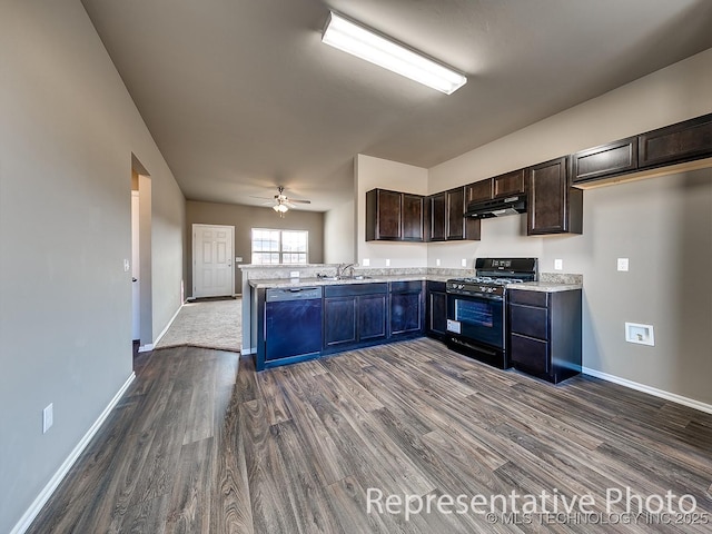 10116 E Biswell Ct, Claremore, OK 74019 - kitchen with gas stove, under cabinet range hood, dishwashing machine, a sink, and dark wood-style flooring