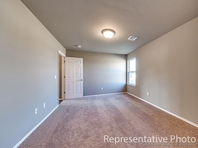 10116 E Biswell Ct, Claremore, OK 74019 - carpeted spare room with baseboards