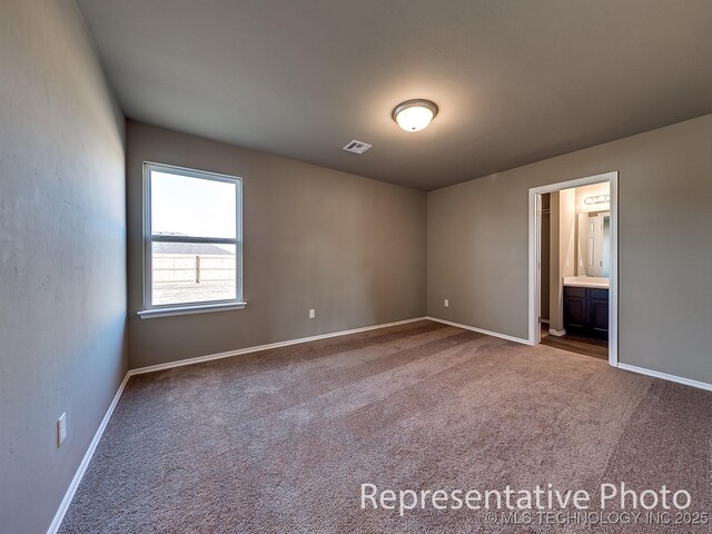 10116 E Biswell Ct, Claremore, OK 74019 - spare room with carpet flooring and baseboards