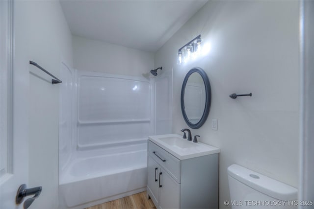 1334 N Nogales Ave, Tulsa, OK 74127 - bathroom with vanity, tub / shower combination, toilet, and wood finished floors