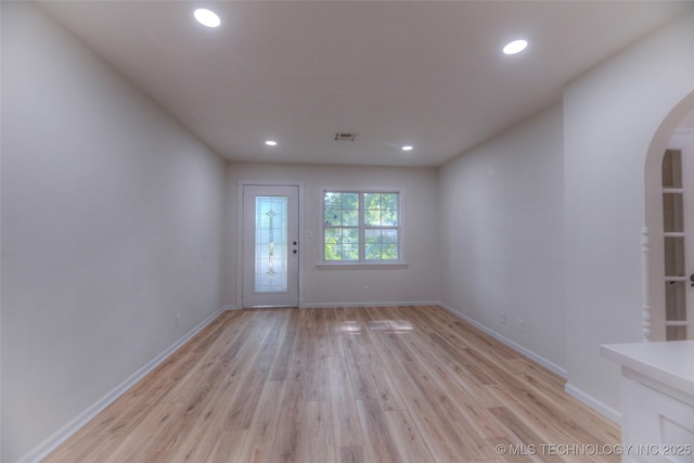 1334 N Nogales Ave, Tulsa, OK 74127 - unfurnished room with arched walkways, light wood-type flooring, recessed lighting, and baseboards