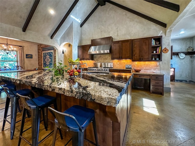 16012 N 145th Ave, Collinsville, OK 74021 - kitchen featuring exhaust hood, beam ceiling, stainless steel range, dark stone counters, and backsplash