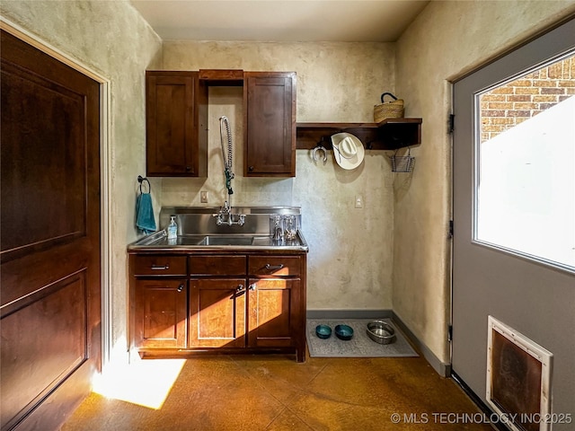 16012 N 145th Ave, Collinsville, OK 74021 - kitchen featuring stainless steel counters, open shelves, and baseboards