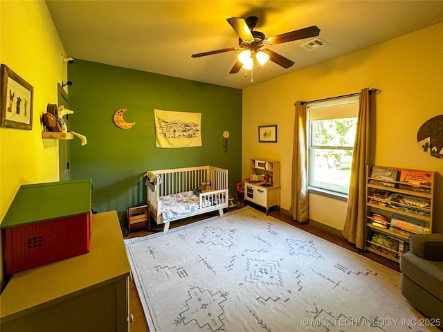 16012 N 145th Ave, Collinsville, OK 74021 - bedroom with a nursery area and a ceiling fan